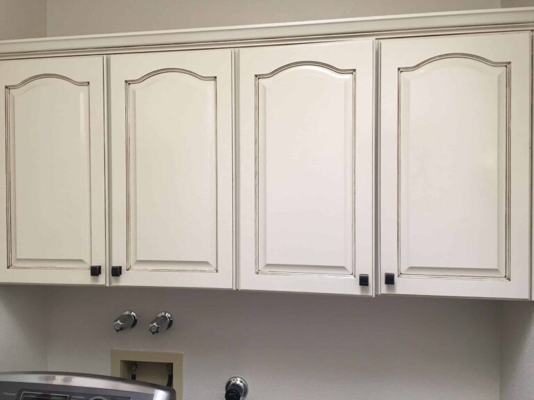 Painted white upper kitchen cabinets