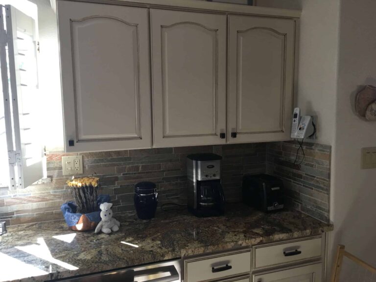 Painted kitchen cabinets with tile backsplash