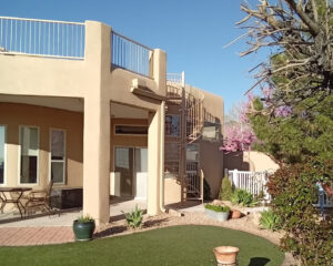 Backyard view of exterior of two-story home
