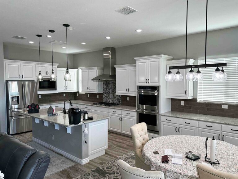 Painted white kitchen cabinets and island